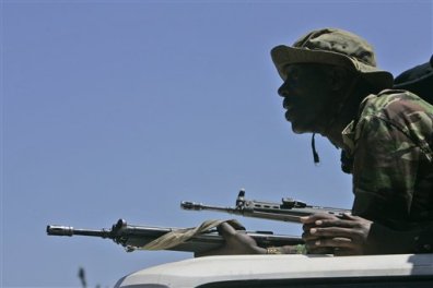 A paramilitary unit armed with G-3 rifles on the look-out.